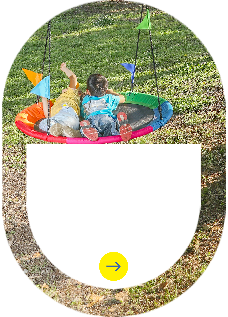 Kids enjoying custom nest swing with rainbow colors - ODM playground equipment by Zoshine